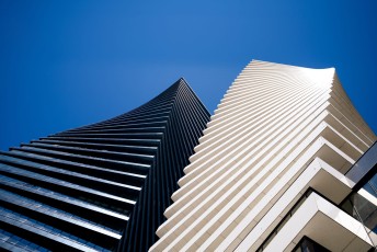low-angle-shot-axis-towers-tbilisi-georgia-blue-sky-1-scaled